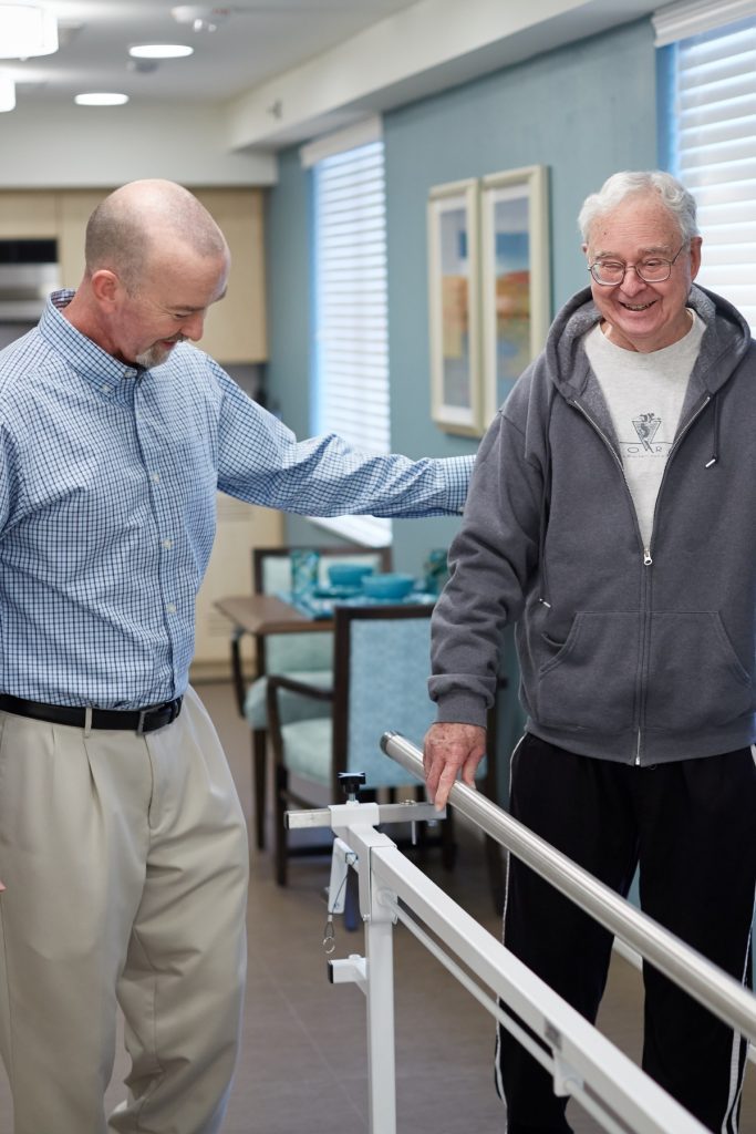 Someren Glen Senior Living Community in Centennial, CO - pt and resident working on physical therapy portrait